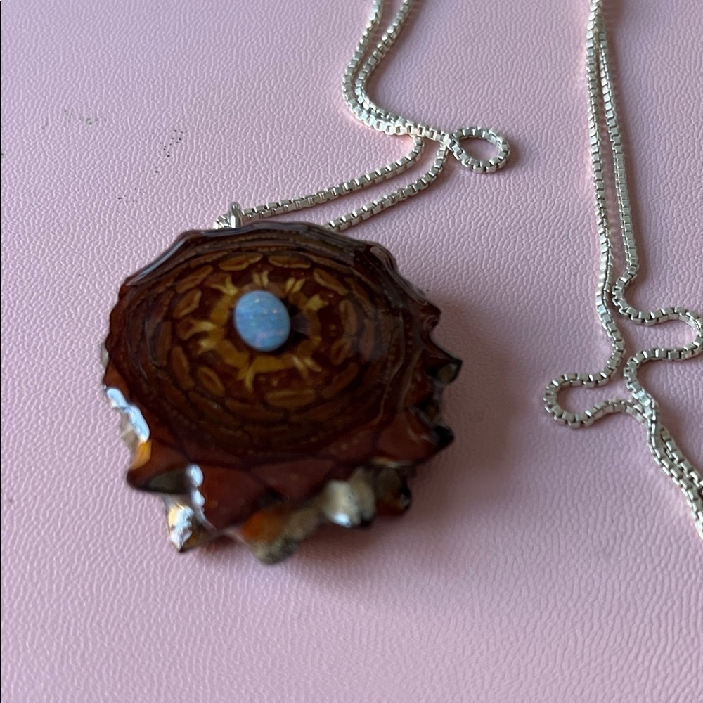 Third eye Pinecone pendant on an 18’’ sterling chain.